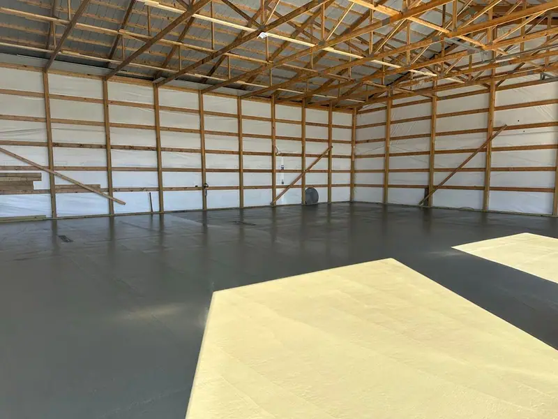 Smooth concrete floor with sunlight coming through building openings