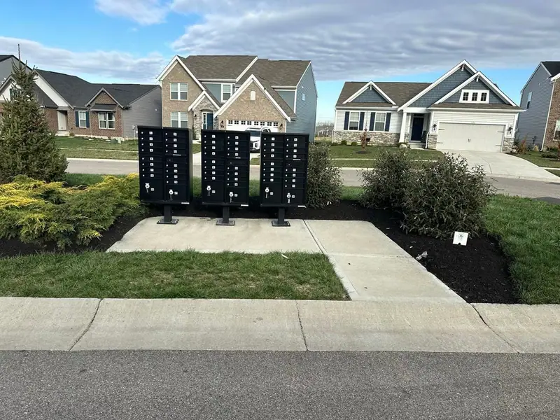 Concrete pad and walk at a neighborhood mailbox cluster