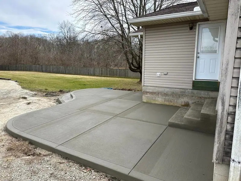 Concrete slab wrapping the side of a house